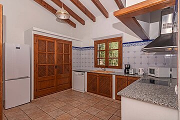 A kitchen with a samsung refrigerator and a microwave