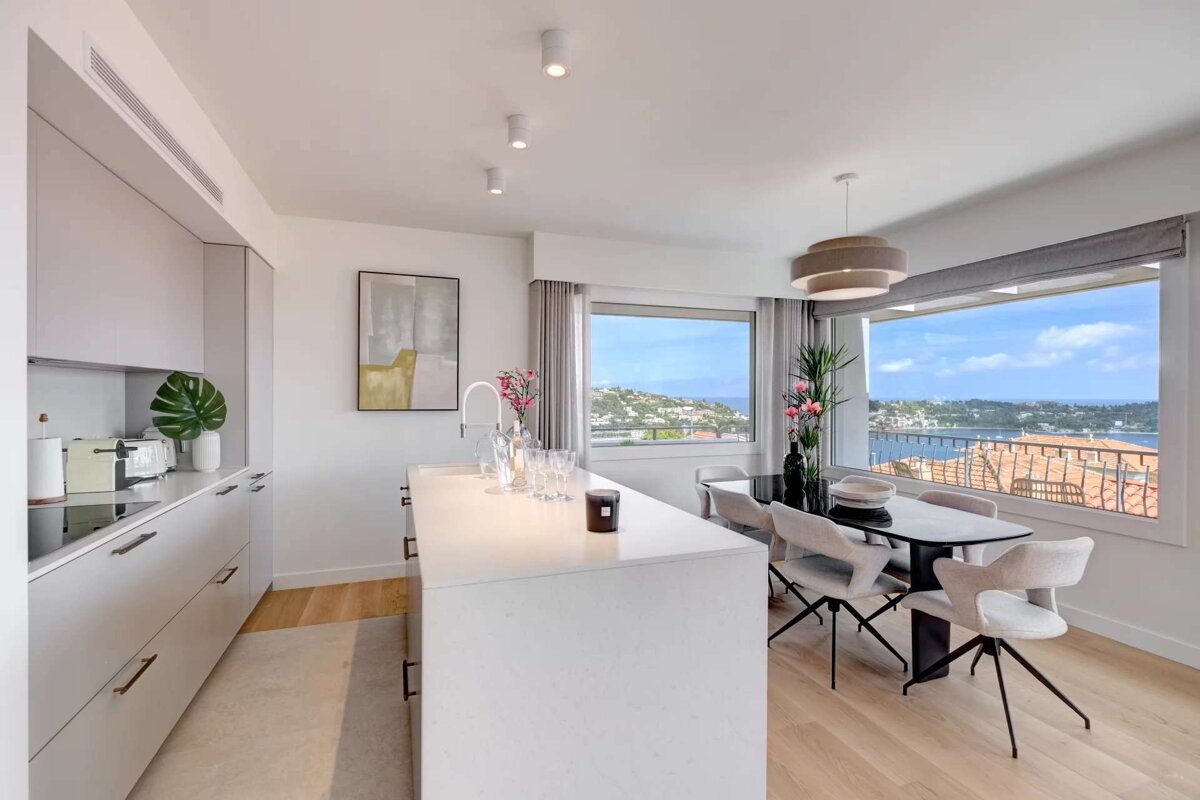 A kitchen and dining area with a large window