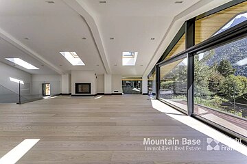 An empty room with a mountain base logo on the bottom