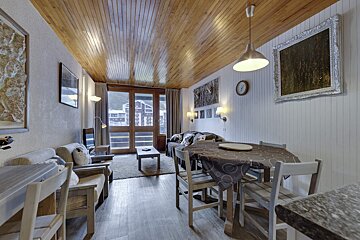 A small kitchen with a sink and a microwave