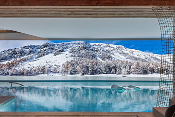 A swimming pool with a mountain in the background