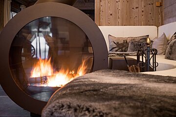 A living room with a fireplace and a couch