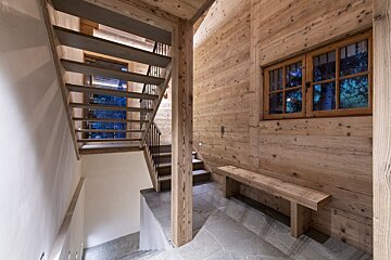 A wooden staircase leading up to the second floor of a house