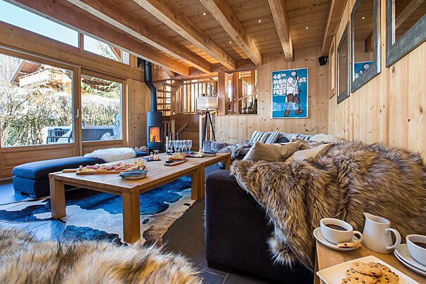 A living room with a poster on the wall that says 44th alps ski festival