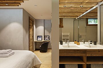 A bathroom with two sinks and two mirrors