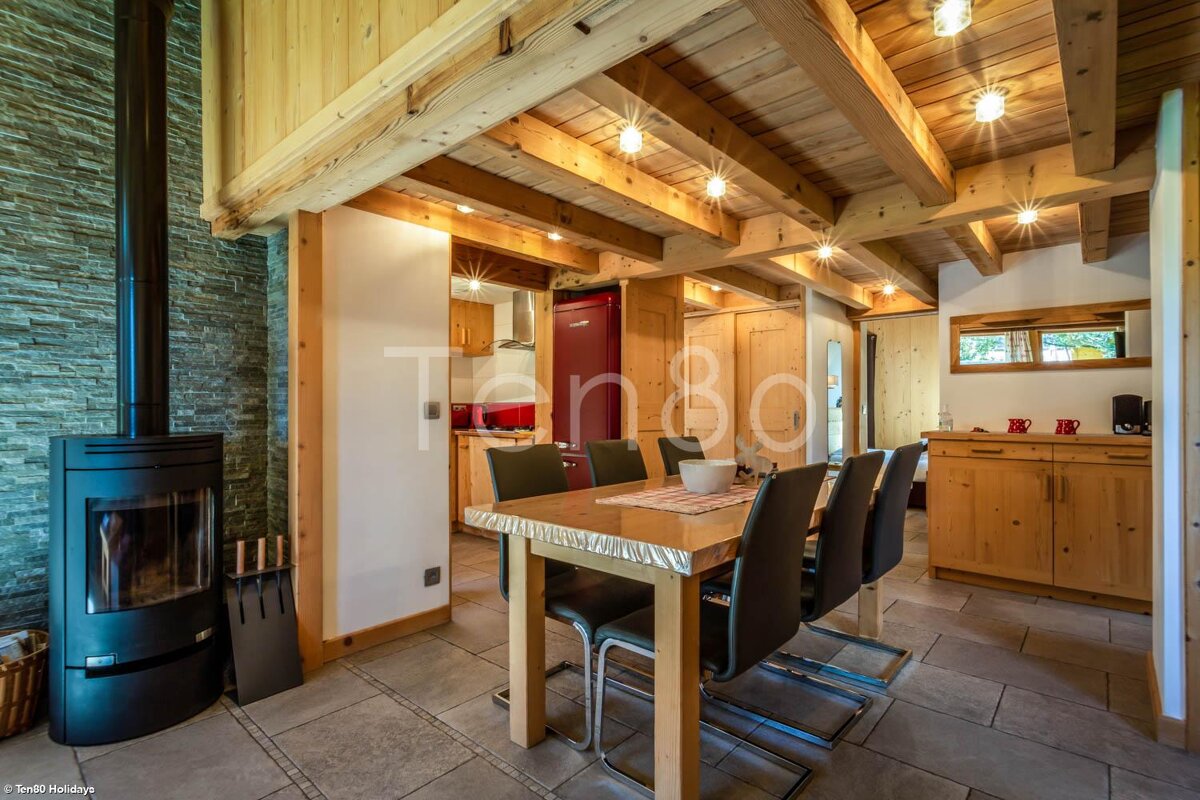 A photo of a dining room with a table and chairs taken by snd holidays