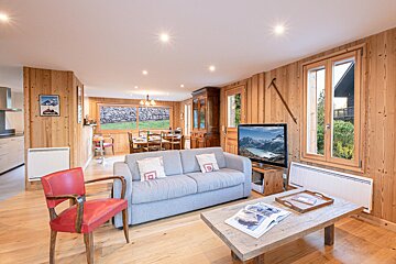 A living room with a couch and a flat screen tv