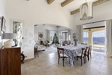 A dining room table with a blue and white table cloth
