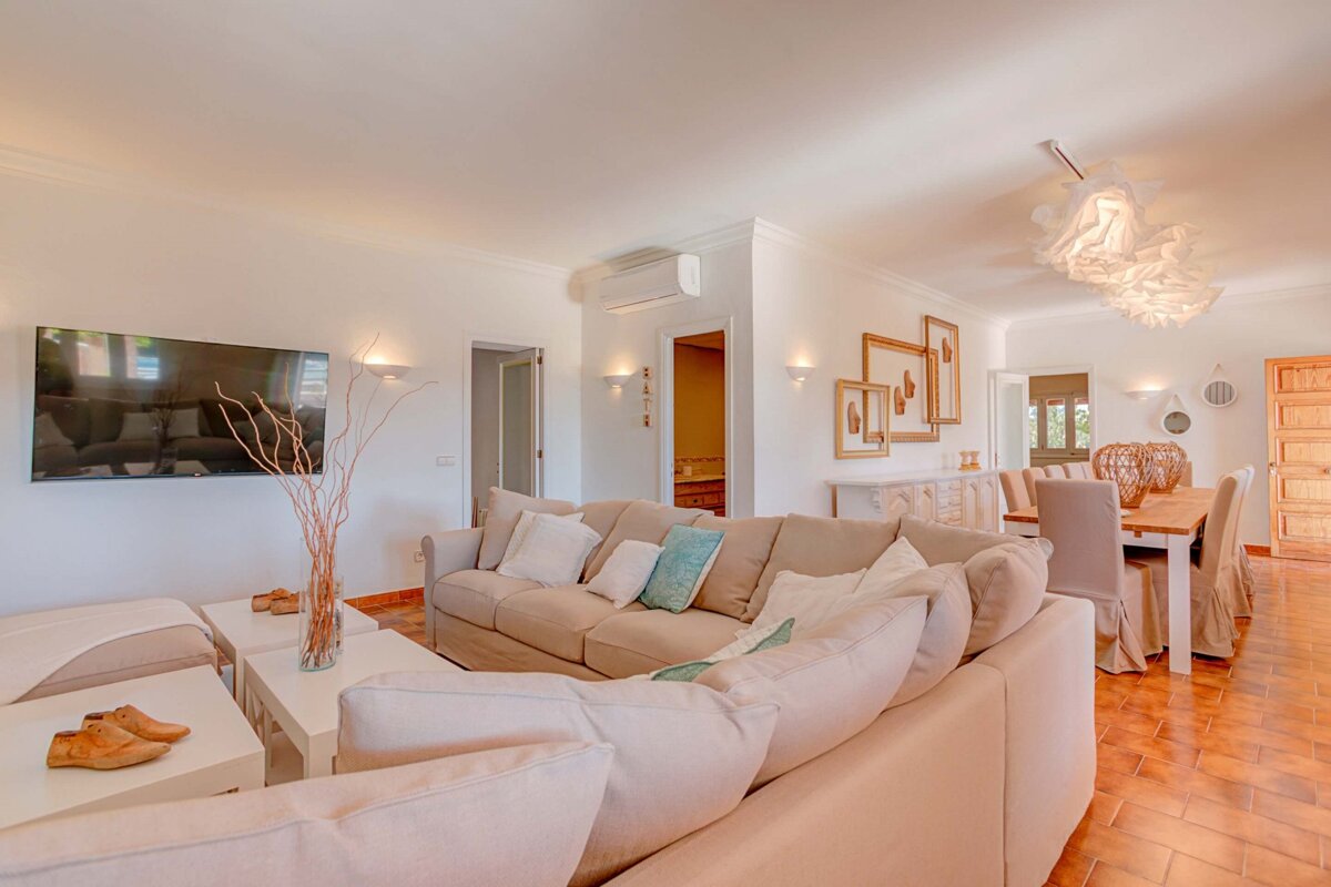 A living room with a couch and a flat screen tv