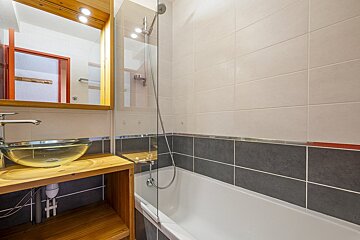 A bathroom with a sink and a bathtub