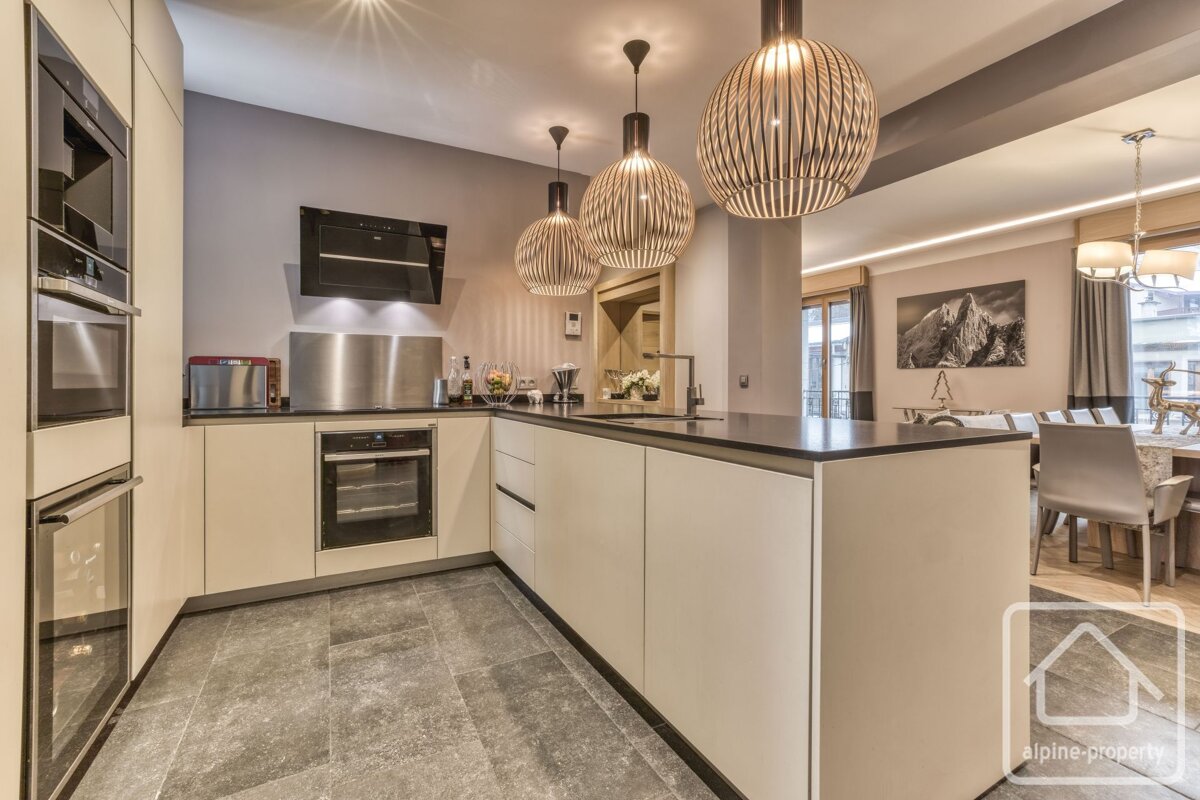 A kitchen with the word alpine property on the bottom