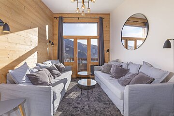 A living room with a couch and two tables