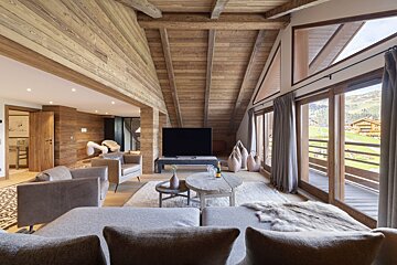 A living room with a large flat screen tv