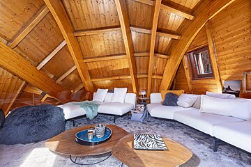 A living room with a couch and two coffee tables
