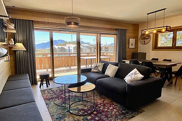 A living room with a couch and a table