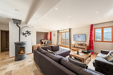 A living room with a couch and a flat screen tv