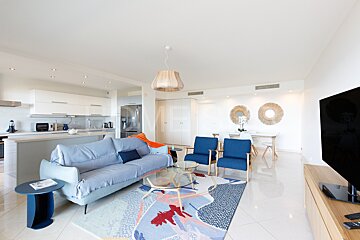 A living room with a couch and a flat screen tv