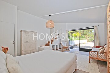 A bedroom with the word home on the wall