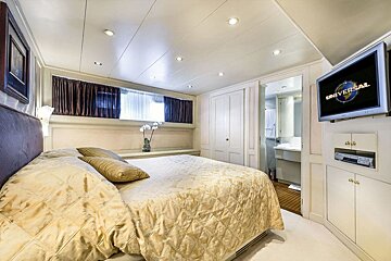 A bedroom with a tv that says universal on it