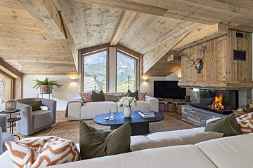 A living room with a fireplace and a couch