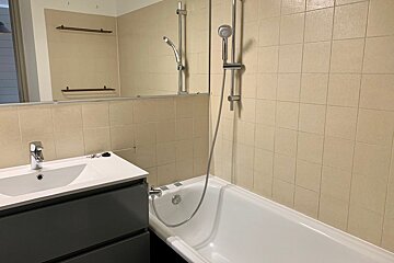A bathroom with a sink and a bathtub