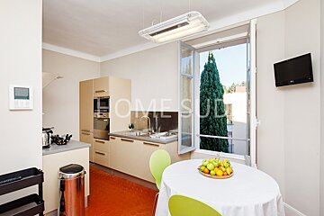 A kitchen with the word home on the wall