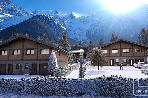 Cozy mountain chalets in a snowy landscape with majestic, sun-drenched peaks towering behind. A serene winter wonderland scene.