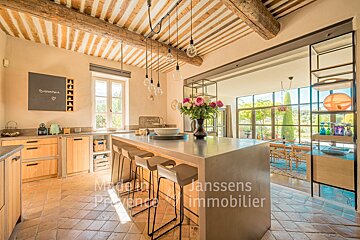 A kitchen with a sign that says essentiel on it