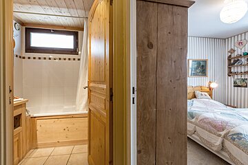 A bedroom with a bunk bed and a poster that says