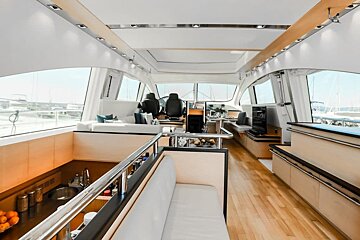 The inside of a boat with a couch and a bar