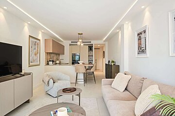 A living room with a couch and a flat screen tv