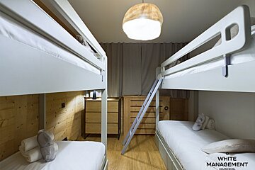 A hot tub with a view of snowy mountains