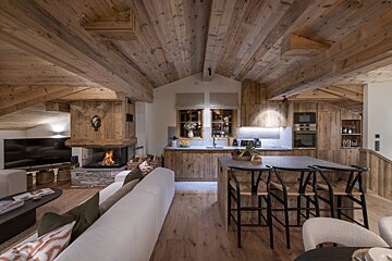 A living room with a couch and a fireplace