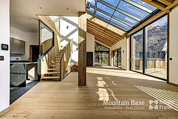 A room with a staircase and a sign that says mountain base