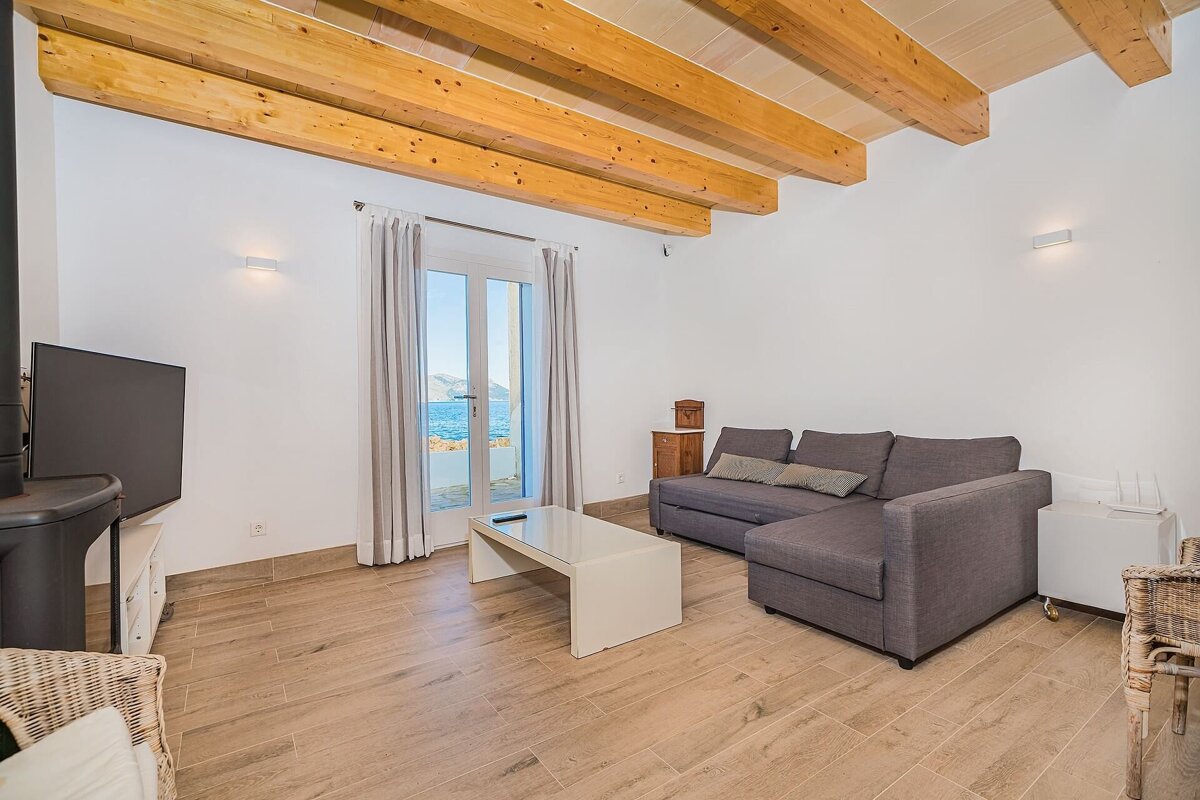 A living room with a couch and a television