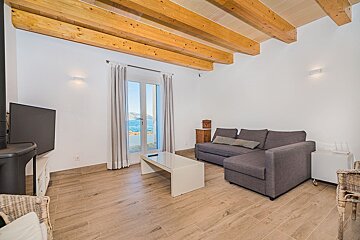 A living room with a couch and a television