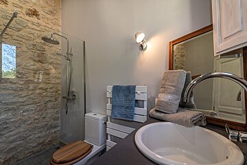 A bathroom with a towel that says cottage on it
