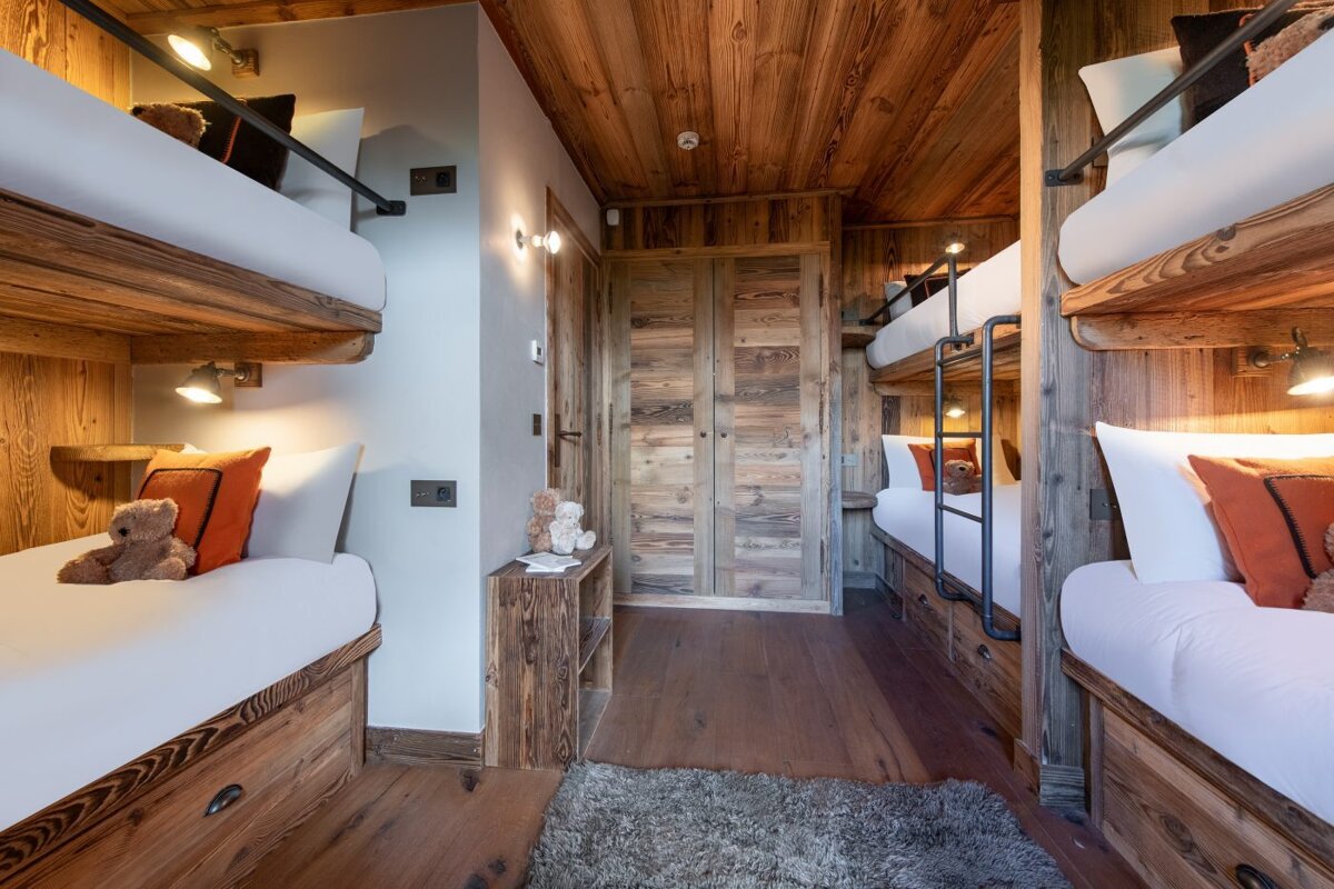 Bunk beds in a room with a wooden ceiling