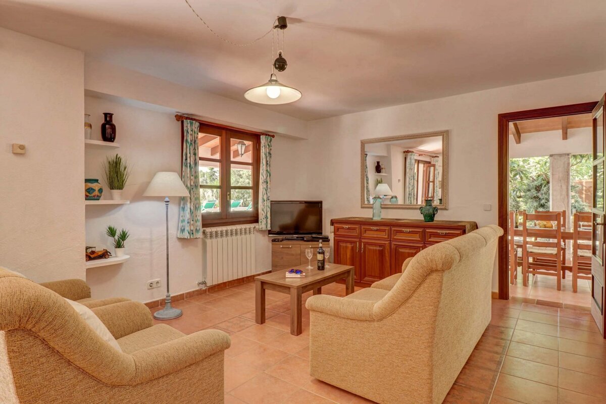 A living room with two couches and a flat screen tv