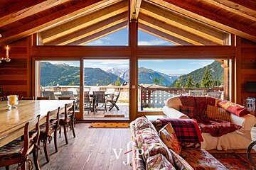 A living room with a view of the mountains and a sign that says vjp