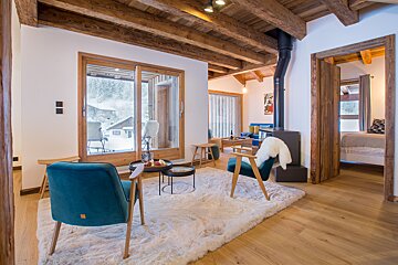 A living room with two chairs and a table