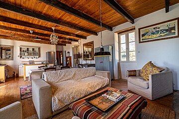 A living room with a couch a chair and a coffee table
