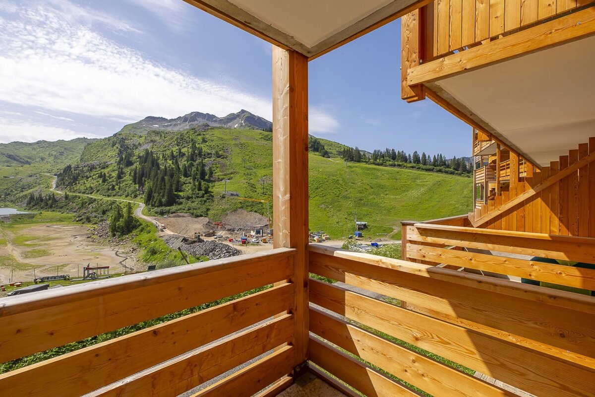 A balcony with a view of a mountain range