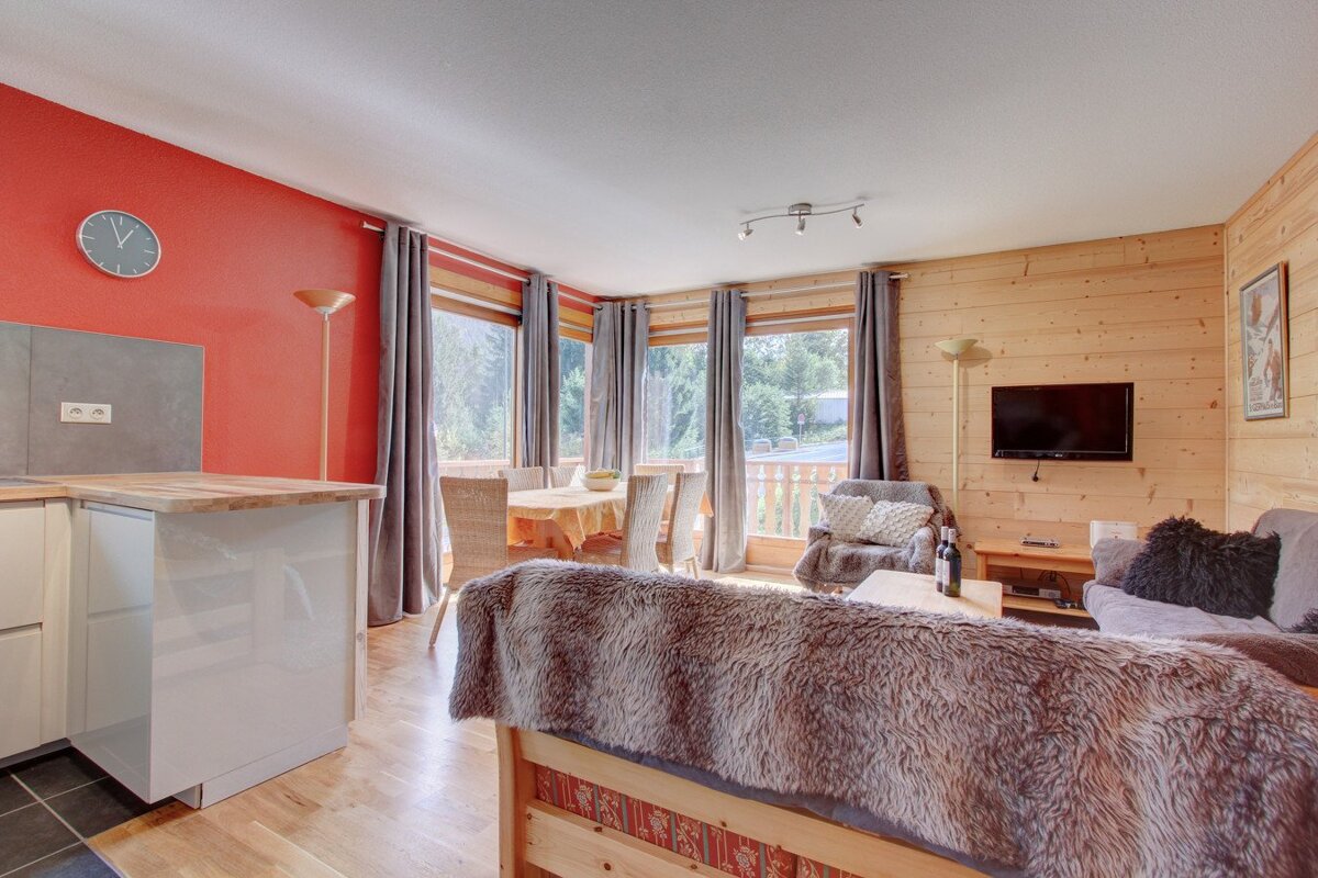 A living room with a fur blanket on the couch