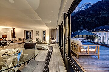 A living room with a view of a mountain