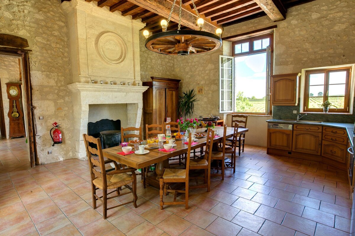 A kitchen with a fire extinguisher on the wall