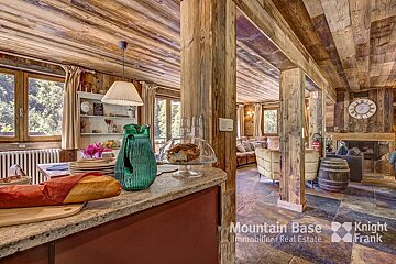 A kitchen with a clock on the wall that says knight frank