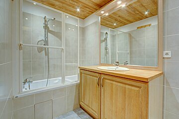 A bathroom with a sink and a bathtub