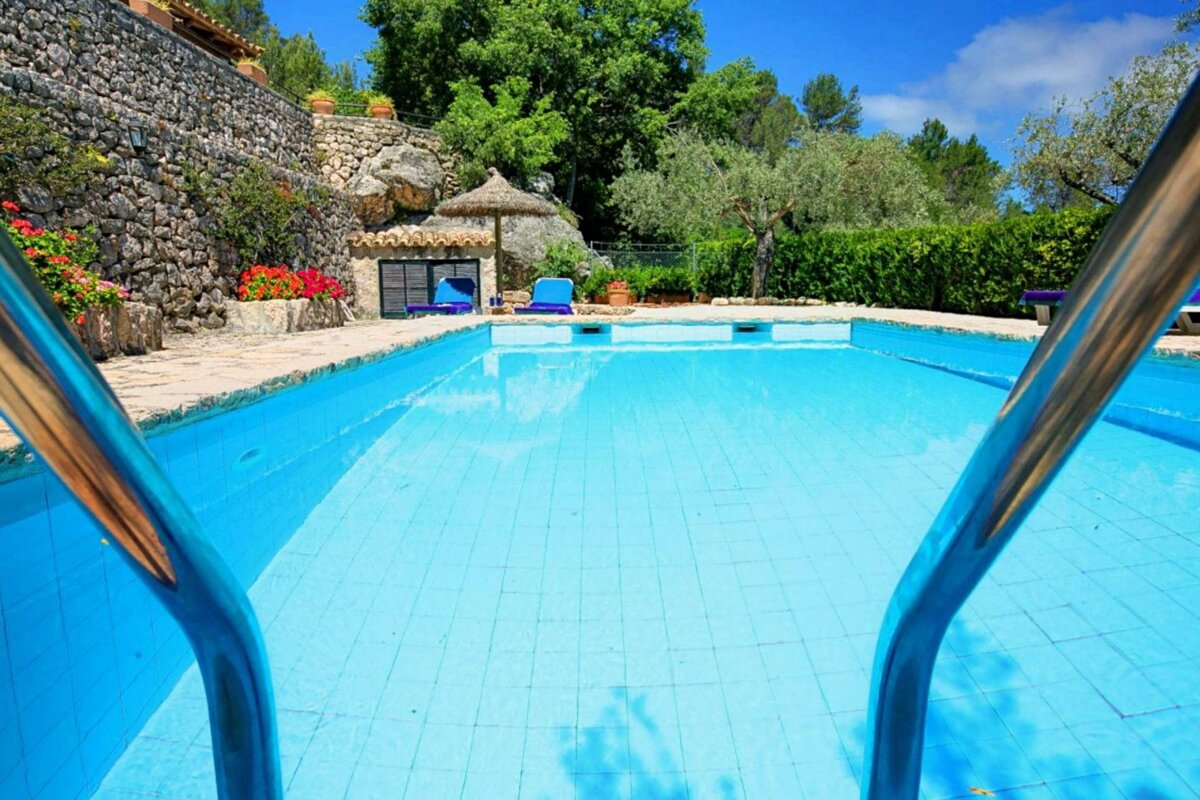 A swimming pool with stairs leading up to it