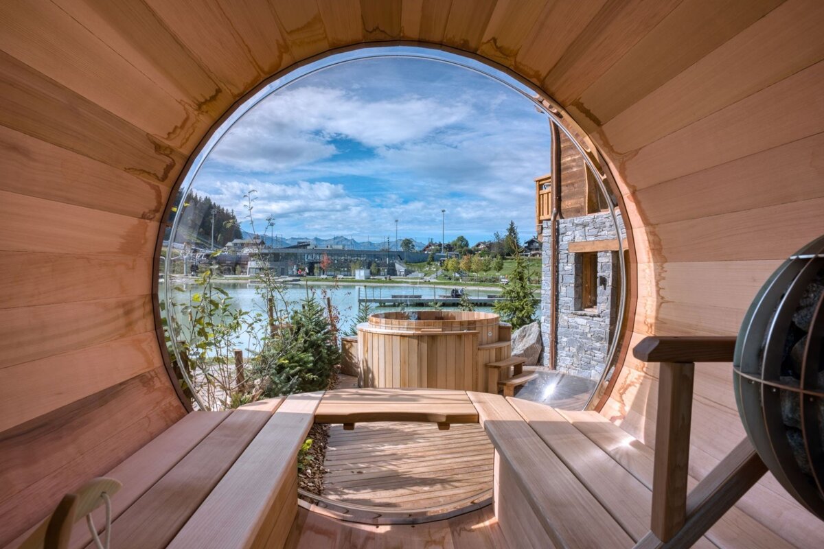 A view of a lake from inside a wooden barrel
